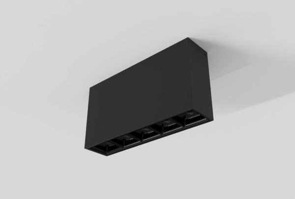 black surface mount rectangular linear light with square segments and black inner trim installed in ceiling
