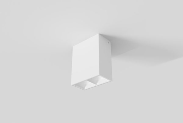 white surface mount rectangular linear light with square segments and white inner trim installed in ceiling