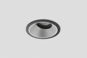 black adjustable anti-glare downlight with matte silver inner trim installed in ceiling