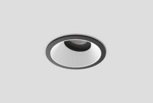 black adjustable anti-glare downlight with matte white inner trim installed in ceiling