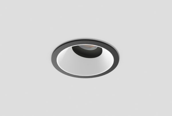 black adjustable anti-glare downlight with matte white inner trim installed in ceiling