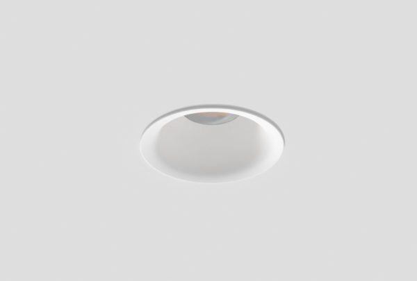 white round recessed downlight installed in ceiling