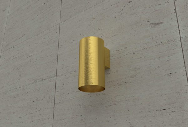 gold can wall light installed on wall