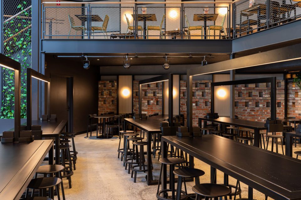 brewery with high tables with recessed LED strip